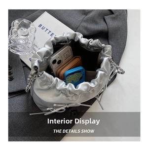Top view of silver drawstring bag interior showing capacity for phone and wallet