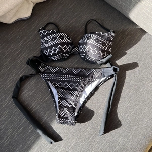 Sexy black and white geometric pattern bikini set with underwire cups and tie-side bottoms