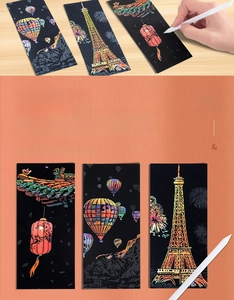 Macro view of DIY city night view scratch bookmarks set with stylized tool and gold foil