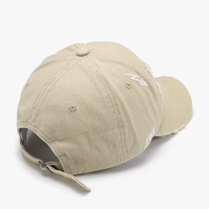 Beige distressed baseball cap with LA embroidery and vintage washed torn details