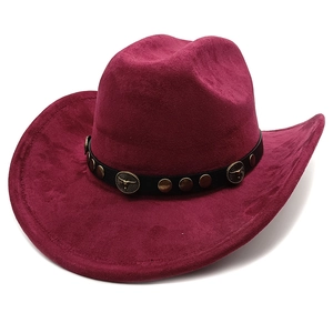 Close-up of burgundy suede cowboy hat featuring black leather band with metal bull head