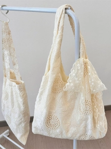 Off-white floral embroidery canvas tote bag with delicate lace bow detailing