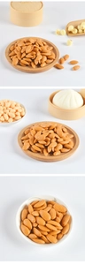 Realistic artificial almonds shown in ceramic bowls and wooden trays for display