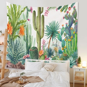 Detail showing bohemian tapestry with desert plants and cacti on a bedroom wall