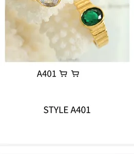 Macro shot of vintage gold rings with green emerald stone and detailed relief engravings
