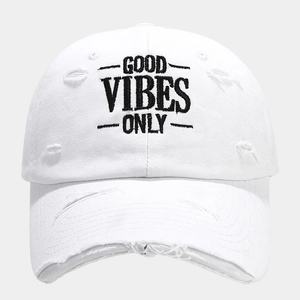 Detail of white cotton baseball cap featuring GOOD VIBES ONLY embroidery and distressed holes