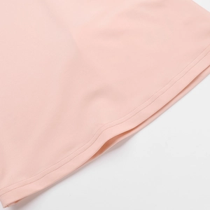 Close-up of pink knit fabric texture and high-quality hem stitching detail for woman top