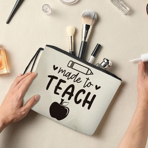Beige canvas makeup bag with made to TEACH print and zipper closure for teachers