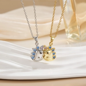 Detail of hedgehog charms in gold and silver plating with blue and pink rhinestones