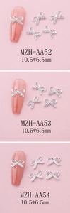 Detailed views of bow-shaped nail charms with rhinestones and pearls measuring 10.5x6.5mm