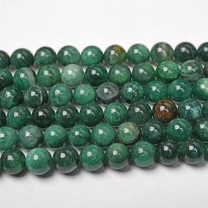 Detailed view of polished natural green mica round beads showing unique stone texture