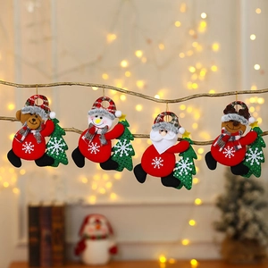Set of Christmas plush ornaments featuring Santa, snowman, bear and reindeer on tree