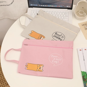 Detail of A4 cute cartoon document bags in beige and pink with dual zipper compartments