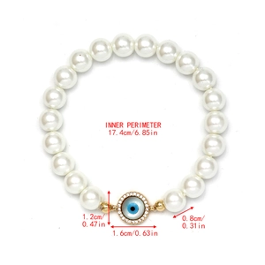 Detailed view of evil eye pearl bracelet with measurements 17.4cm length and 1.6cm pendant
