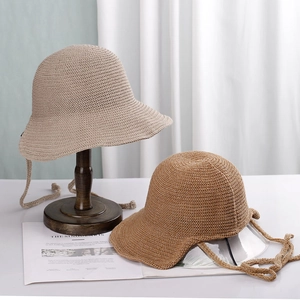 Japanese style woven bucket hat for women with adjustable chin strap in beige and camel