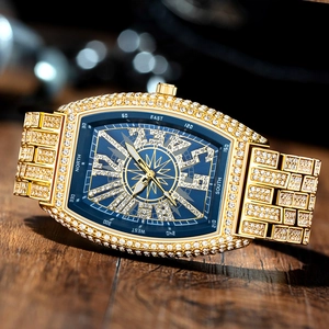 Macro shot of luxury gold diamond watch with deep blue compass dial on dark wood