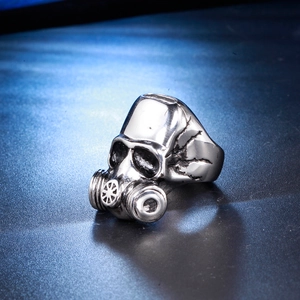 Detail view of a men's stainless steel gas mask ring with a vintage punk silver finish