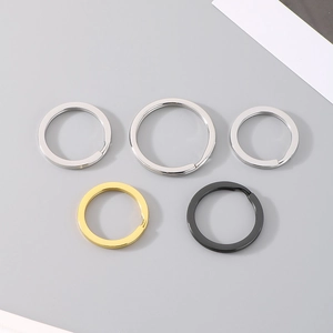 Detailed view of stainless steel key rings in various sizes and metallic finishes