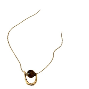 U-shaped stainless steel necklace with brown tiger eye stone pendant on gold chain