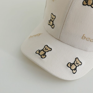 Breathable beige baseball cap for kids featuring brown embroidered bear patterns