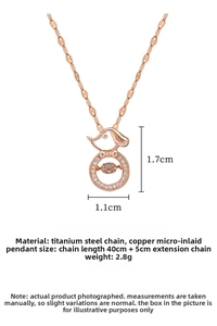 Detailed view of dog pendant with dancing diamond and rose gold titanium chain specs