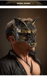 Detail view of a vintage wolf mask with gold and black metallic texture for masquerades