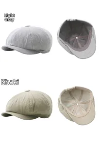 Detail of light gray and khaki corduroy beret hats showing striped fabric texture