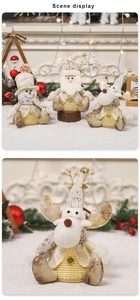 Detail shot of plush Christmas reindeer figurine with gold glitter texture and bell