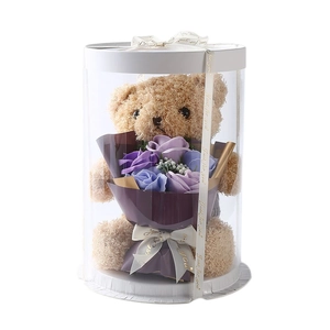 Teddy bear gift box with soap flower bouquet in a transparent cylinder for Valentine's Day