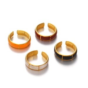 Adjustable gold bamboo rings with colorful enamel finishes in orange red black and marble