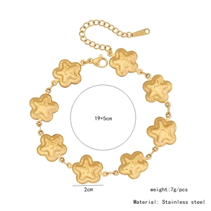 Detailed view of golden stainless steel flower bracelet with adjustable chain and star charms