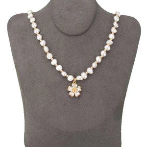 18k gold-plated irregular pearl necklace with a sparkling zircon flower pendant