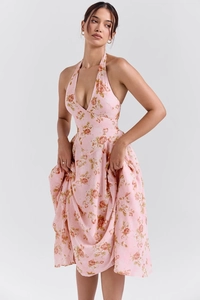 Detail of pink floral halter dress with deep V-neck and flowy mid-length skirt