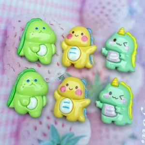 Close-up of colorful resin dinosaur figurines for DIY phone cases and hair accessories