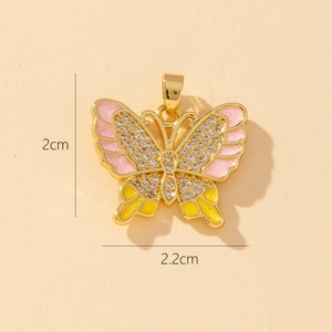 Detailed size view of 2cm by 2.2cm butterfly pendant with pink enamel and crystals