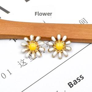 Pair of sweet white and yellow daisy flower earrings with enamel finish on gold base