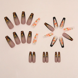 Long ballet press-on nails featuring autumn maple leaves and vintage flame patterns