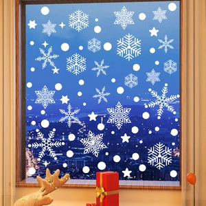 Detail of white Christmas snowflake static window decals with starry festive ornaments