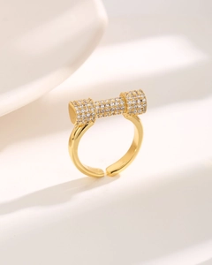 Detailed close-up of a gold-plated adjustable ring featuring a pavé-set zircon cylinder