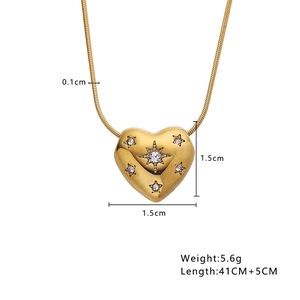 Detailed view of golden heart pendant with star zircons and 41cm+5cm chain size