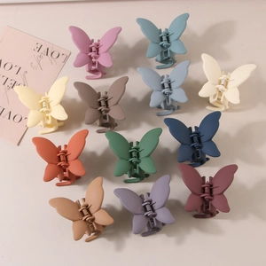 Set of 12 matte butterfly hair claw clips in various Morandi colors for women