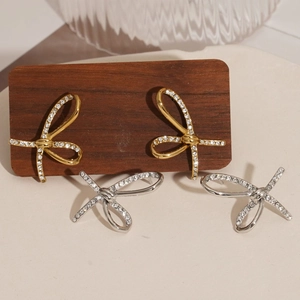 Polished 316 stainless steel bow earrings with sparkling cubic zirconia in gold and silver