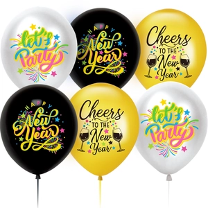 Detail of latex balloons in white, black, and gold with New Year party printing