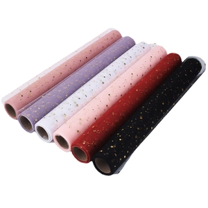 Rolls of star and moon gold foil tulle mesh fabric for floral bouquet gift wrapping
