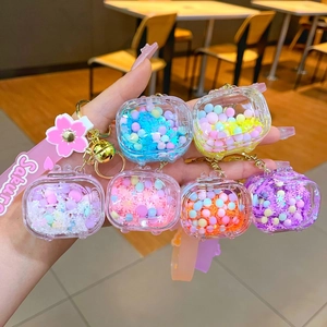 Luminous snowflake television-shaped quicksand bottle keychains in vibrant colors