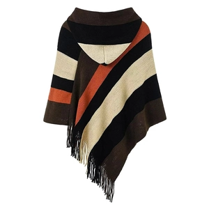 Detail view of the colorful striped knit poncho back with hood and fringe decoration