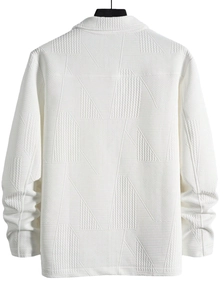 Macro shot of white jacket fabric with geometric textured patterns and back collar detail