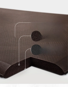 Macro detail of 19mm thick anti-fatigue PU leather kitchen mat with non-slip bottom texture