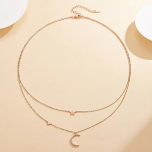 Detail of double-layer S925 silver necklace with micro-pave zircon moon and stars
