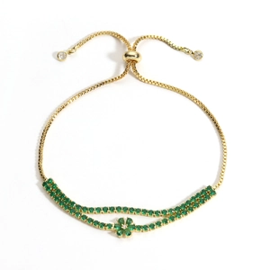 18K gold plated double-row bracelet with green gemstones and flower charms on white backdrop